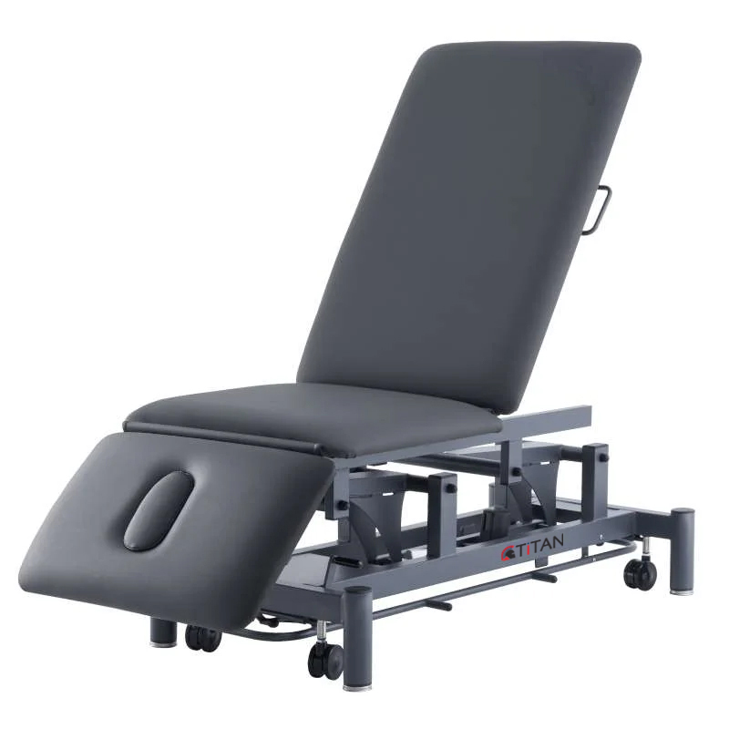 ET3BLACKFRAMECONTOUR_1800x1800 A black medical treatment table with wheels, ideal for easy mobility during medical procedures.