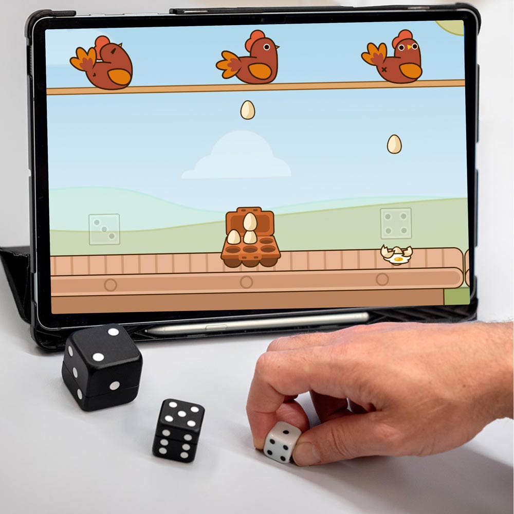 Chicken-game2 A person using a tablet to play a game with dice