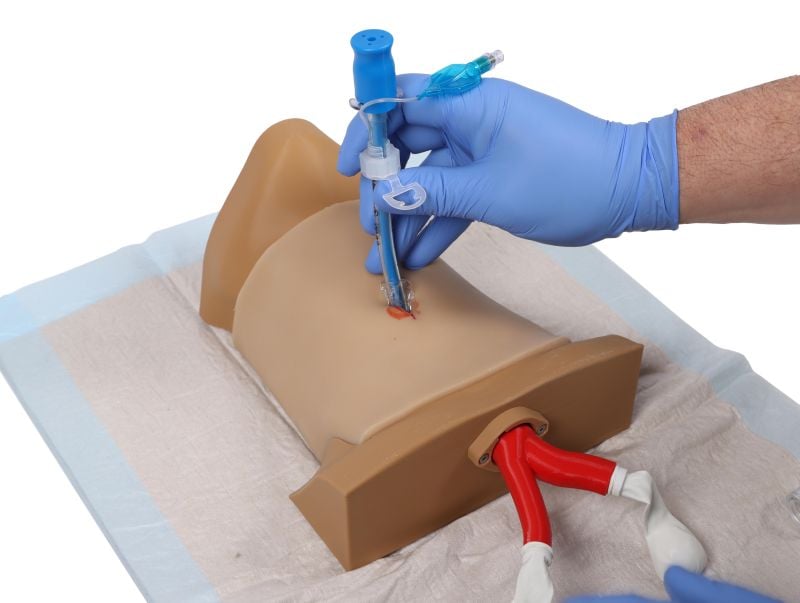 image4 A person inserting a plastic device using a needle.